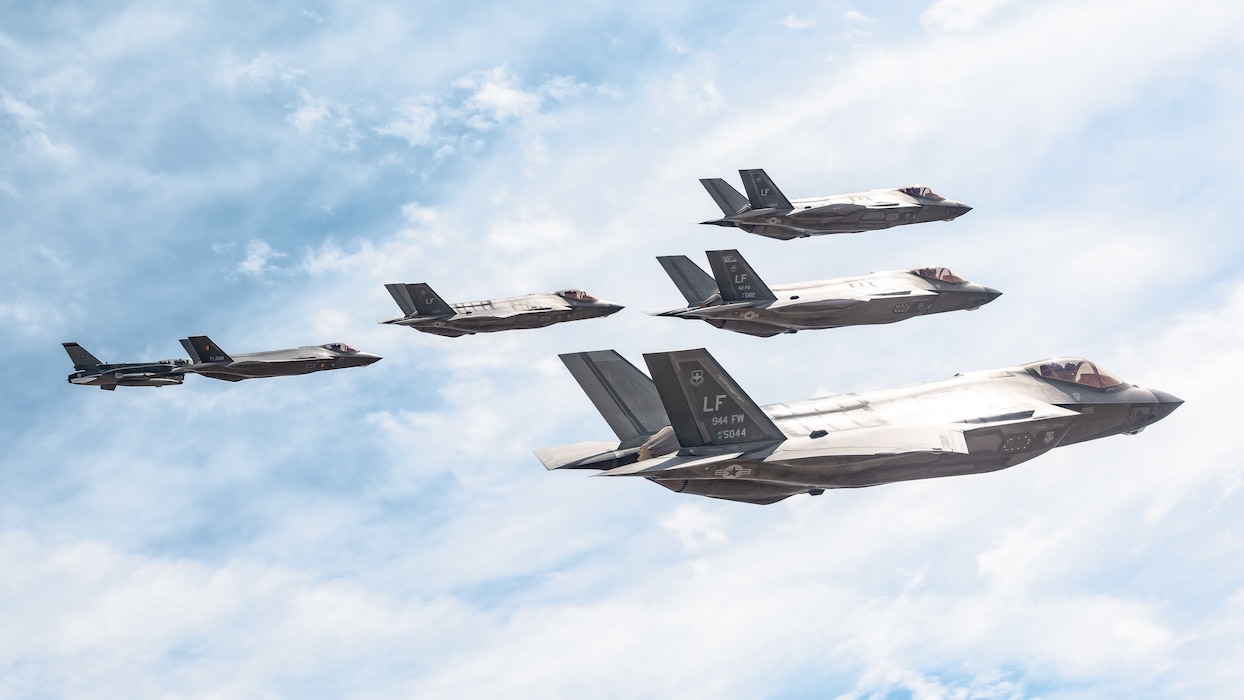 A Singapore Air Force F-16D Fighting Falcon, a Belgian Air Component F-35A Lightning II and an F-35A Lightning II aircraft assigned to the 56th Fighter Wing bank in formation near Luke Air Force Base, Ariz., April 10, 2026. The training reinforces interoperability and combat effectiveness across partner nations. (U.S. Air Force photo by Senior Airman Belinda Guachun-Chichay)