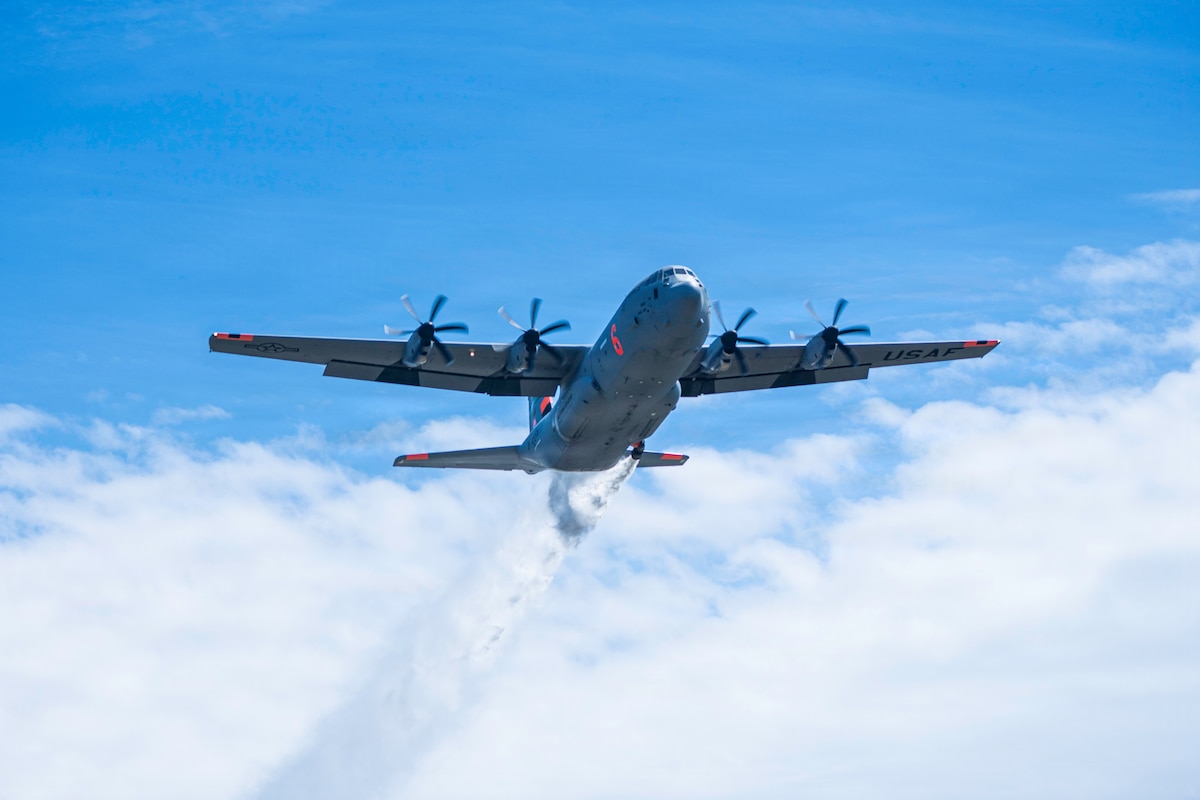 Aircrew operating a C-130J with a Modular Aerial Fire Fighting System conduct a water drop during MAFFS spring training at Tahoe National Forest, Calif., April 20, 2026. Training prepares military and civilian crews for wildfire response operations. (U.S. Air Force photo by Master Sgt. Garrett Wake)