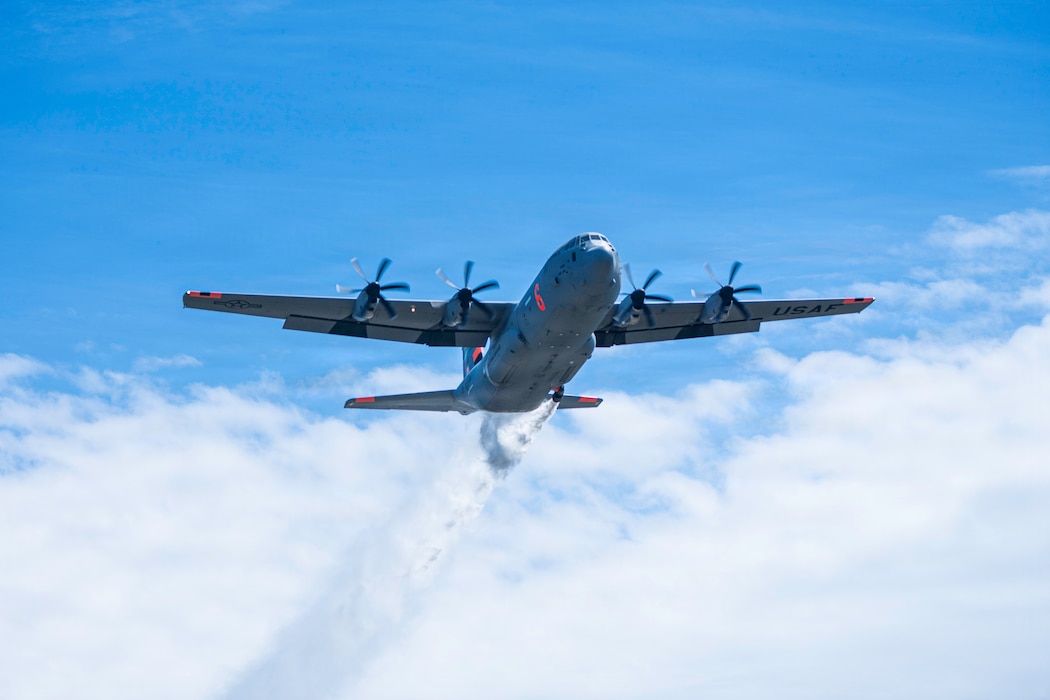 Aircrew operating a C-130J with a Modular Aerial Fire Fighting System conduct a water drop during MAFFS spring training at Tahoe National Forest, Calif., April 20, 2026. Training prepares military and civilian crews for wildfire response operations. (U.S. Air Force photo by Master Sgt. Garrett Wake)