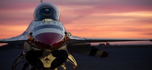 An F-16 Fighting Falcon sits on the flight line before sunrise at Travis Air Force Base, Calif., April 24, 2026, ahead of the Wings Over Solano air show. The event showcases aerial excellence and Air Force capabilities. (U.S. Air Force photo by Kenneth Abbate)