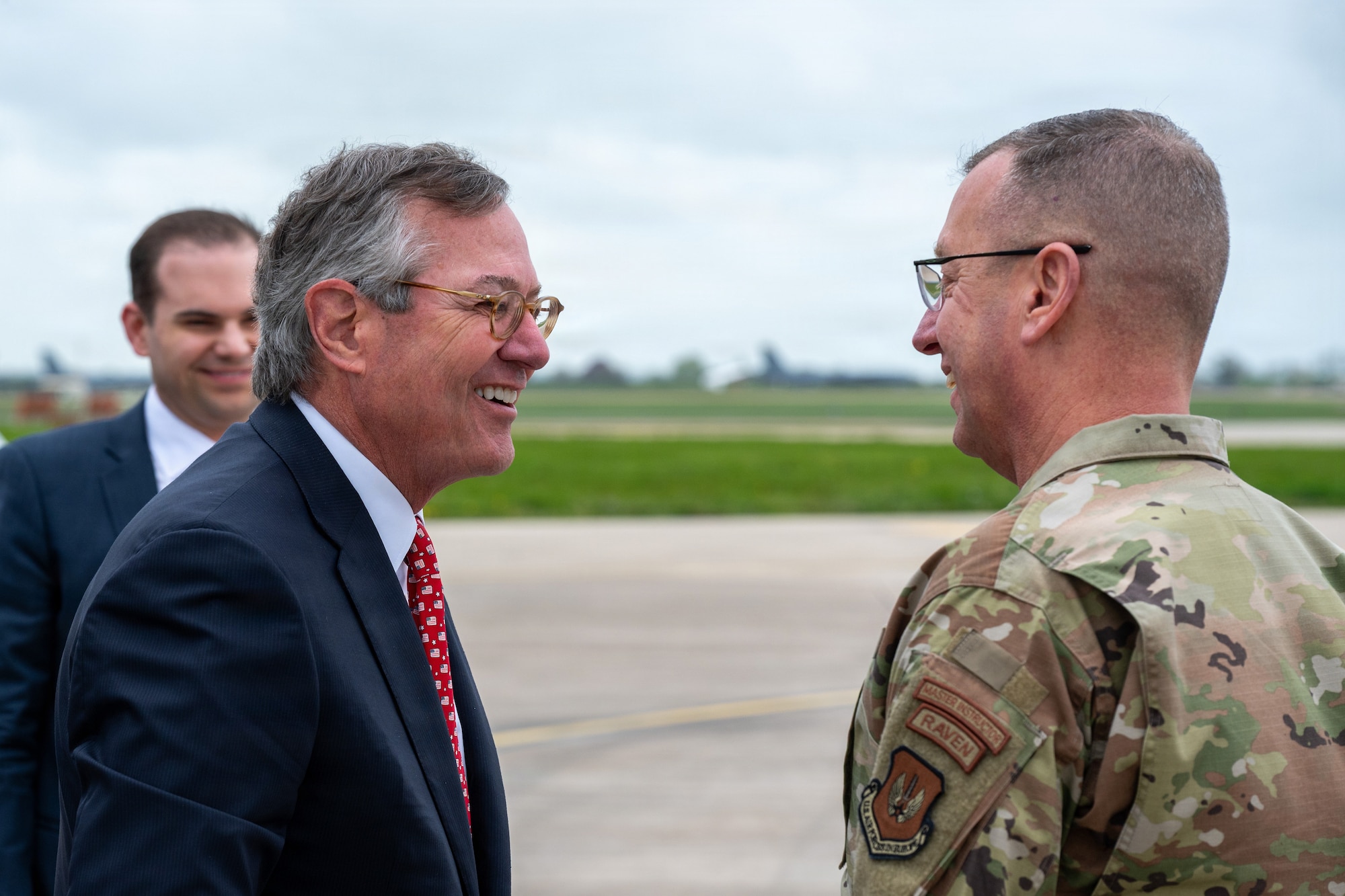 Warren E. Stephens, U.S. Ambassador to the United Kingdom, speaks with U.S. Air Force Col. Michael J. Jewell