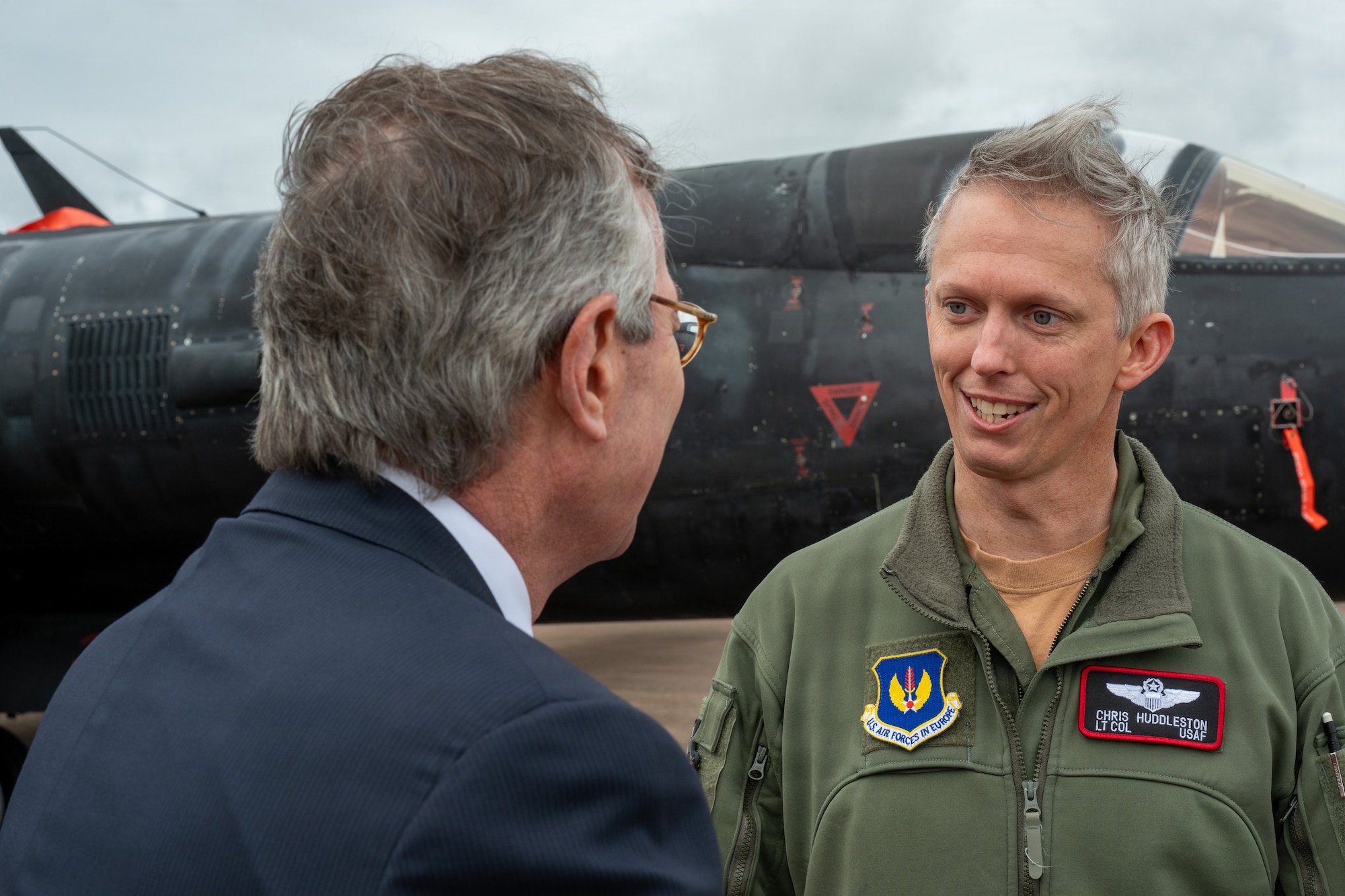 Warren E. Stephens, U.S. Ambassador to the United Kingdom, speaks with U.S. Air Force Lt. Col. Christopher S. Huddleston, 99th Expeditionary Reconnaissance Squadron director of operations