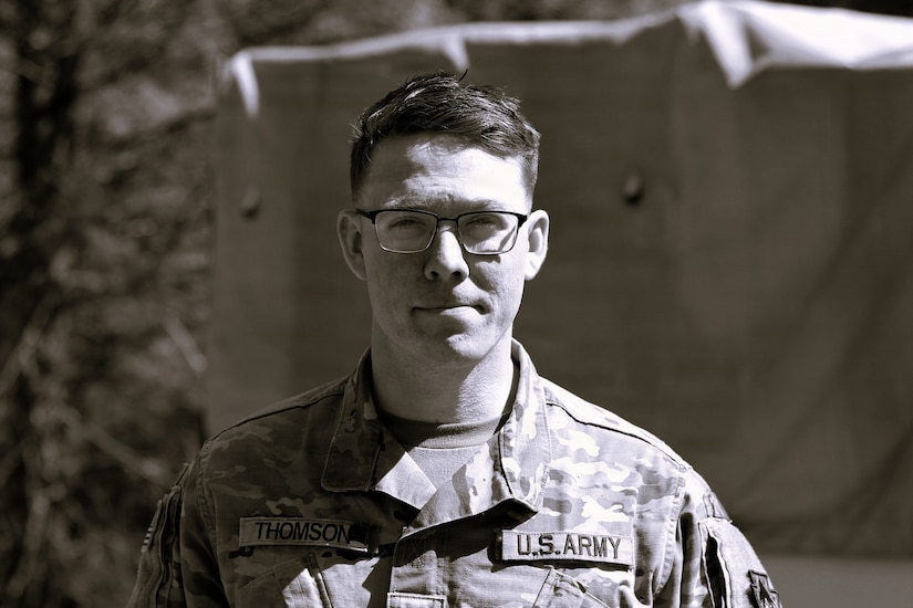 U.S. Army Sgt. David Thomson, a public affairs specialist with the 109th Mobile Public Affairs Detachment, currently deployed to Germany in support of U.S. Special Operations Command Europe, poses for a photo at Fort Indiantown Gap, Pennsylvania, April 7, 2024. (U.S. Army National Guard photo illustration by Capt. Leanne Trindel)