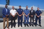 (From left to right) Rear Adm. (ret.) Errington Shurland, executive director of the Regional Security System, Rear Adm. Jean-Baptiste Soubrier, commander of French forces in the Caribbean and Command Task Group 4.6, Rear Adm. Jeffrey Randall, director of Joint Interagency Task Force South (JIATFS), Rear Adm. Walter Hansen, commander of Netherlands Forces in the Caribbean and Command Task Group 4.4, Mr. Andres Blanco, acting director of Joint Task Force Maritime, and Rear Adm. Adam Chamie, commander of U.S. Coast Guard Southeast District, pose in front of a seized drug-trafficking vessel at JIATFS' headquarters in Key West, Fla., on April 29. The principals participated in a Trilateral Conference which provided opportunities to discuss and improve how the allies and partners work together to defeat regional threats through detecting, monitoring and interdicting trafficking of illicit narcotics movements in the Caribbean and western Atlantic through cooperative law enforcement efforts.
