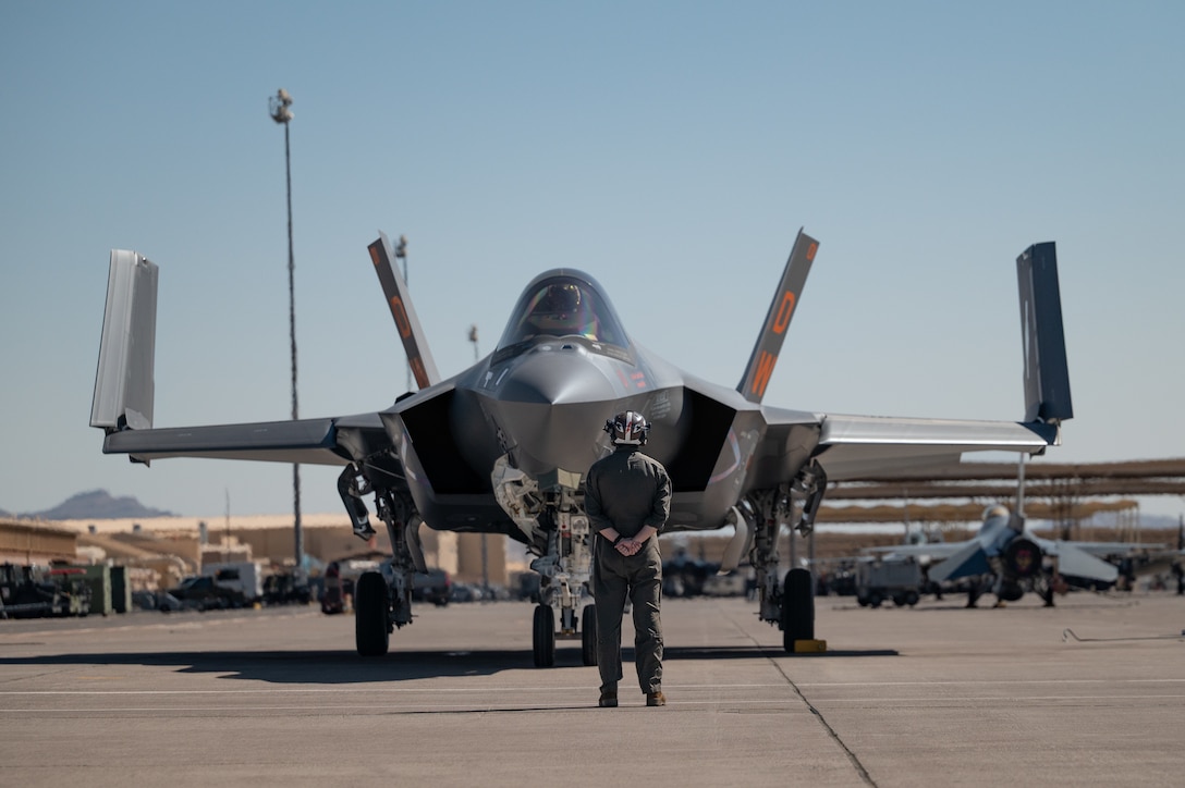 U.S. Marine Corps Staff Sgt. Justin Braun, a powerline mechanic assigned to Marine Fighter Attack Squadron (VMFA) 251, 2nd Marine Aircraft Wing, Marine Corps Air Station Cherry Point, North Carolina, inspects an F-35C Lightning II prior to a mission in support of Red Flag-Nellis 25-3 at Nellis Air Force Base, Nevada, July 22, 2025. Red Flag strengthens integration among joint force partners to maximize strategic capabilities, readiness and lethality. (U.S. Air Force photo by Airman 1st Class Jennifer Nesbitt)