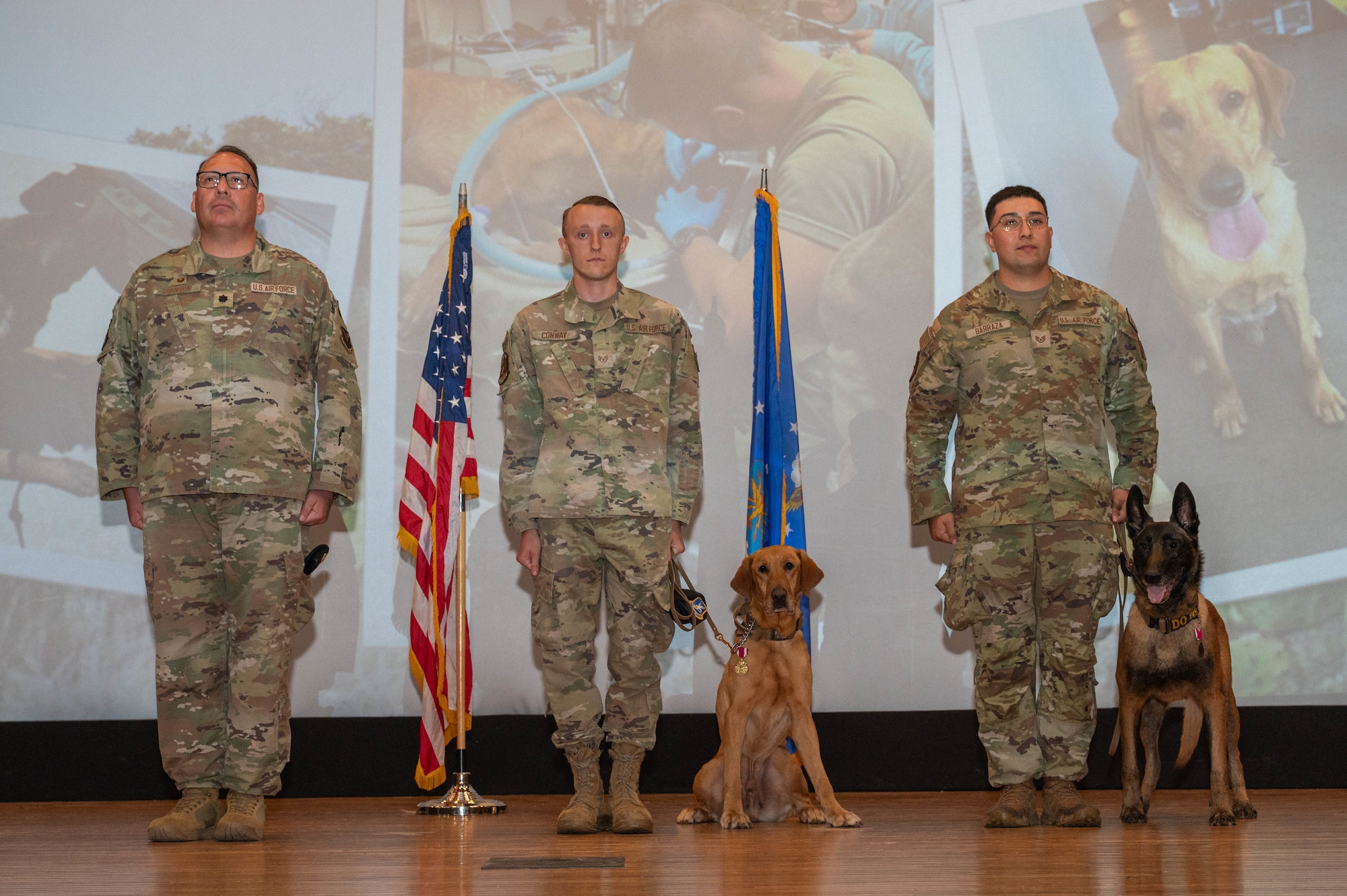 The official party stands at attention during a military working dog retirement ceremony at Dyess Air Force Base, Texas, April 29, 2026. The 7th Security Forces Squadron ceremony honored MWDs Baker and Dduco for their years of service in patrol, detection and installation defense. (U.S. Air Force photo by Airman 1st Class William Neal)