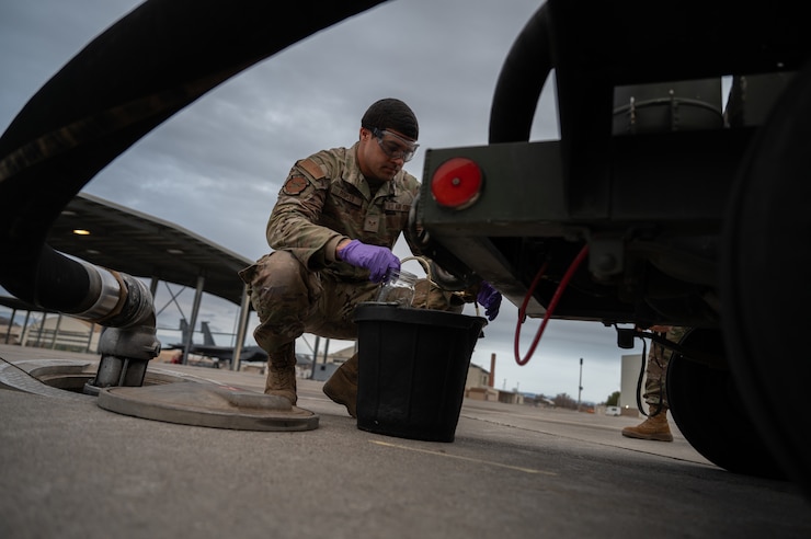 Airman testing fuel quality.