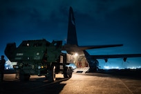 A U.S. Army M142 High Mobility Artillery Rocket System sits near a C-130J Super Hercules assigned to the 40th Airlift Squadron after a rapid insertion during exercise Balikatan 2026 at Clark Air Base, Philippines, April 23, 2026. The operation demonstrates joint force mobility and alliance strength. (U.S. Air Force photo by Senior Airman Jade M. Caldwell)
