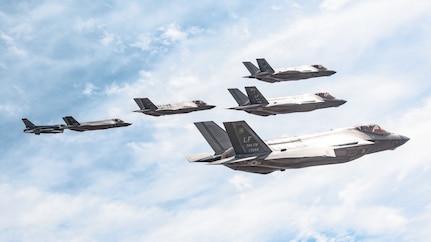 A Singapore Air Force F-16D Fighting Falcon, a Belgian Air Component F-35A Lightning II and an F-35A Lightning II aircraft assigned to the 56th Fighter Wing bank in formation near Luke Air Force Base, Ariz., April 10, 2026. The training reinforces interoperability and combat effectiveness across partner nations. (U.S. Air Force photo by Senior Airman Belinda Guachun-Chichay)