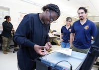 JOINT BASE SAN ANTONIO – FORT SAM HOUSTON – (April 16, 2026) – U.S. Army Staff Sgt. McKeitha Williams, of Henderson, N.C., a dental specialist instructor assigned to the Echo Co., 264th Medical Training Battalion, participated in a usability test of the Rugged Ozone Sterilization System Model M1 (ROSS M1) at the Medical Education and Training Campus. During the month of April, NAMRU San Antonio research engineers visited with dental and veterinary science instructors to test the usability of the ROSS M1. The ROSS M1 is a portable device with the capability of sterilizing medical instruments on the battlefield or in austere environments which will help in the treatment and recovery of wounded warfighters. Navy Medicine Research & Development (NMR&D) employs highly qualified medical researchers and works alongside a wide range of research and development partners to keep abreast of best practices and advances in medical knowledge on behalf of Navy Medicine to increase warfighter lethality. NAMRU San Antonio, part of NMR&D, conducts gap-driven combat casualty care, craniofacial, and directed energy research in support of Navy, Marine Corps and joint U.S. warfighter health readiness and lethality while engaged in routine and expeditionary operations. (U.S. Navy photo by Burrell Parmer, NAMRU San Antonio/Released)