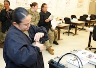JOINT BASE SAN ANTONIO – FORT SAM HOUSTON – (April 16, 2026) – U.S. Army Staff Sgt. Erisa Sablan, of Guam, a dental specialist instructor assigned to the Echo Co., 264th Medical Training Battalion, participated in a usability test of the Rugged Ozone Sterilization System Model M1 (ROSS M1) at the Medical Education and Training Campus. During the month of April, NAMRU San Antonio research engineers visited with dental and veterinary science instructors to test the usability of the ROSS M1. The ROSS M1 is a portable device with the capability of sterilizing medical instruments on the battlefield or in austere environments which will help in the treatment and recovery of wounded warfighters. Navy Medicine Research & Development (NMR&D) employs highly qualified medical researchers and works alongside a wide range of research and development partners to keep abreast of best practices and advances in medical knowledge on behalf of Navy Medicine to increase warfighter lethality. NAMRU San Antonio, part of NMR&D, conducts gap-driven combat casualty care, craniofacial, and directed energy research in support of Navy, Marine Corps and joint U.S. warfighter health readiness and lethality while engaged in routine and expeditionary operations. (U.S. Navy photo by Burrell Parmer, NAMRU San Antonio/Released)