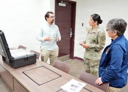 JOINT BASE SAN ANTONIO – FORT SAM HOUSTON – (April 2, 2026) – Biomedical engineer Andres Martinez Murillo, joined by research scientist Tarea Burton, assigned to Naval Medical Research Unit (NAMRU) San Antonio explain the characteristics of the Rugged Ozone Sterilization System Model M1 (ROSS M1) to U.S. Army Staff Sgt. Guadalupe Vivar, of Vineland, N.J., a non-commission officer in charge, Preventive Dentistry Specialty Course at the U.S. Army Medical Center of Excellence. During the month of April, NAMRU San Antonio research engineers visited with dental and veterinary science instructors to test the usability of the ROSS M1. The ROSS M1 is a portable device with the capability of sterilizing medical instruments on the battlefield or in austere environments which will help in the treatment and recovery of wounded warfighters. Navy Medicine Research & Development (NMR&D) employs highly qualified medical researchers and works alongside a wide range of research and development partners to keep abreast of best practices and advances in medical knowledge on behalf of Navy Medicine to increase warfighter lethality. NAMRU San Antonio, part of NMR&D, conducts gap-driven combat casualty care, craniofacial, and directed energy research in support of Navy, Marine Corps and joint U.S. warfighter health readiness and lethality while engaged in routine and expeditionary operations. (U.S. Navy photo by Burrell Parmer, NAMRU San Antonio/Released)