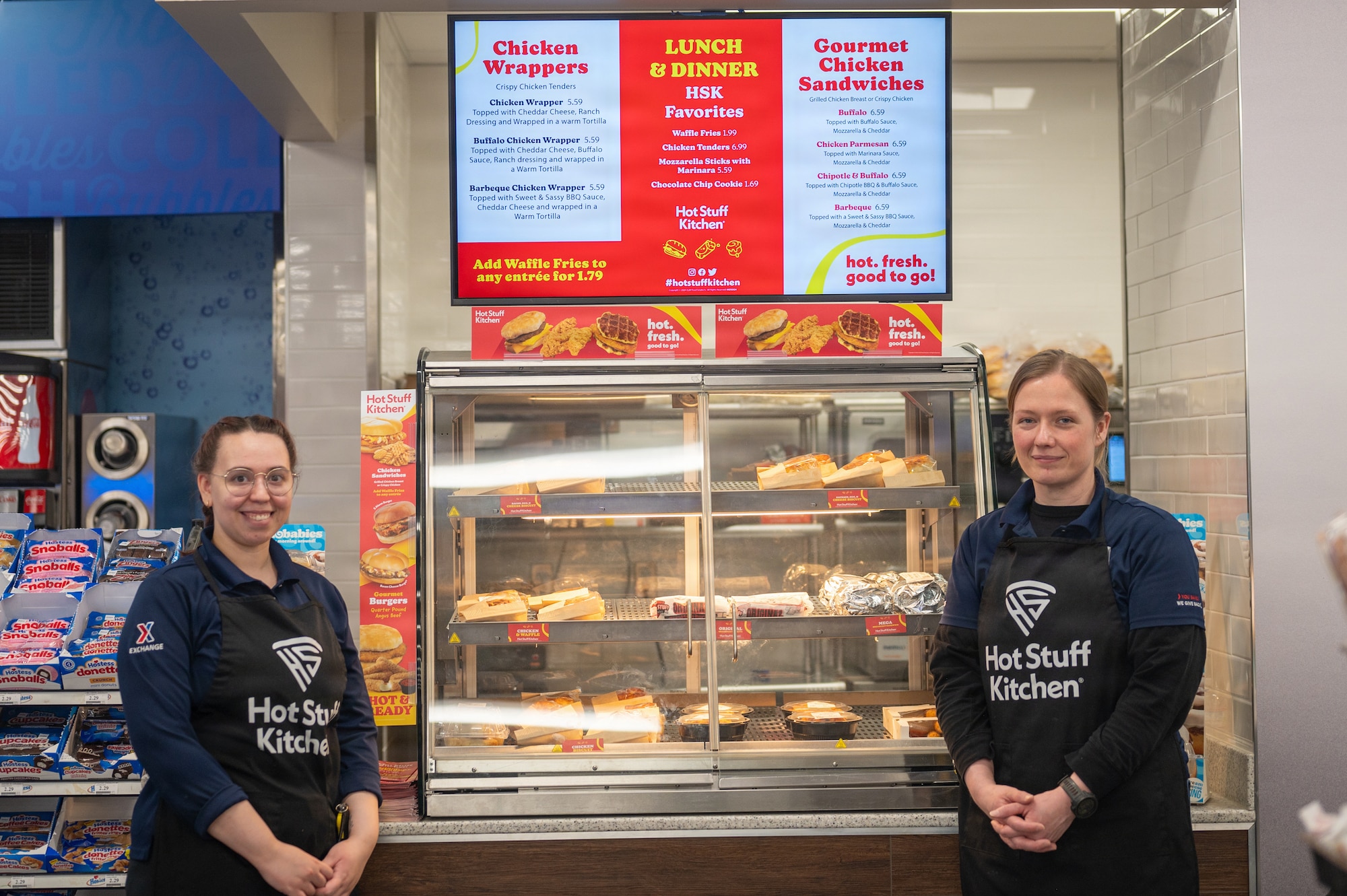 Employees at the Elmendorf Express pose during their grand re-opening ceremony on Joint Base Elmendorf-Richardson, Alaska, April 23, 2026.