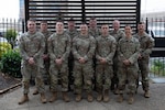 U.S. Soldiers with the Nebraska and North Dakota National Guards, assigned to Joint Task Force-District of Columbia in support of the DC Safe and Beautiful mission, pose for a group photo at a hotel in Alexandria, Virginia, April 28, 2026. About 2,500 National Guard members are supporting the mission, providing critical assistance to the Metropolitan Police Department to help ensure the safety of residents, commuters and visitors throughout the District. (U.S. Army National Guard photo by Staff Sgt. Thomas Norris)