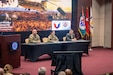 The AMCOM command team, from left to right, Command Sgt. Maj. Christopher Doss, Maj. Gen. Lori Robinson, commanding general, and Don Nitti, deputy to the commanding general, hosted the town hall meeting to address workforce priorities, operational updates and organizational changes.