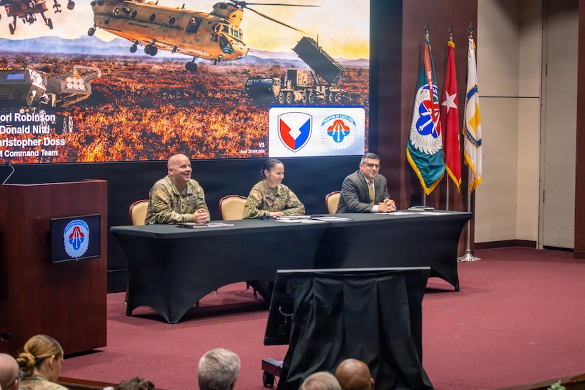 The AMCOM command team, from left to right, Command Sgt. Maj. Christopher Doss, Maj. Gen. Lori Robinson, commanding general, and Don Nitti, deputy to the commanding general, hosted the town hall meeting to address workforce priorities, operational updates and organizational changes.