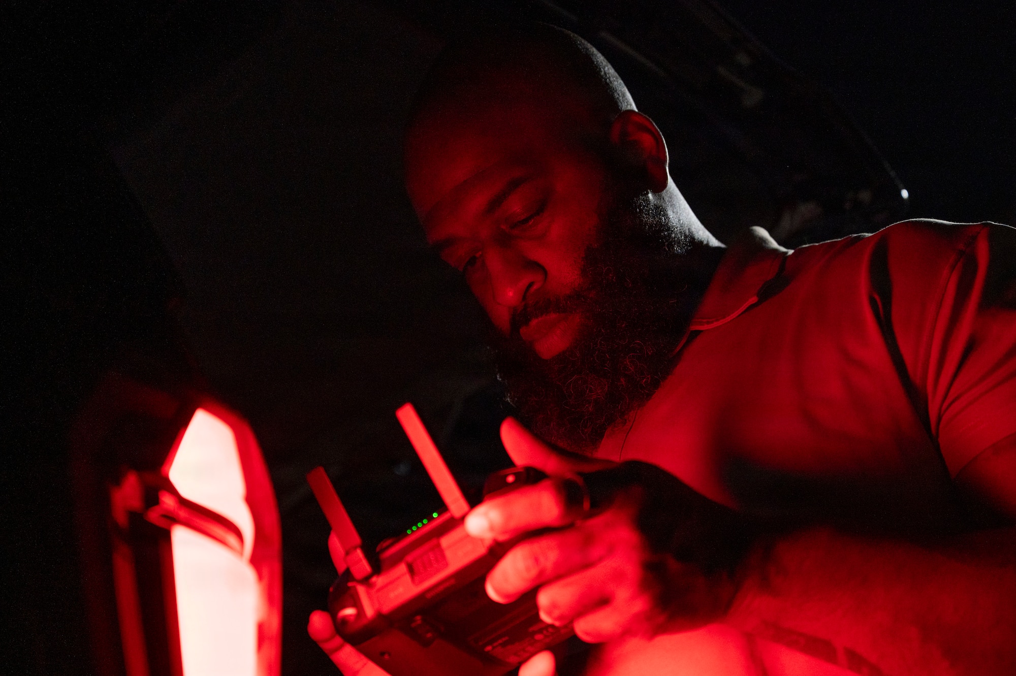 Technician operating a drone