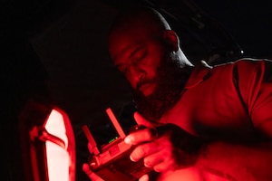 Technician operating a drone