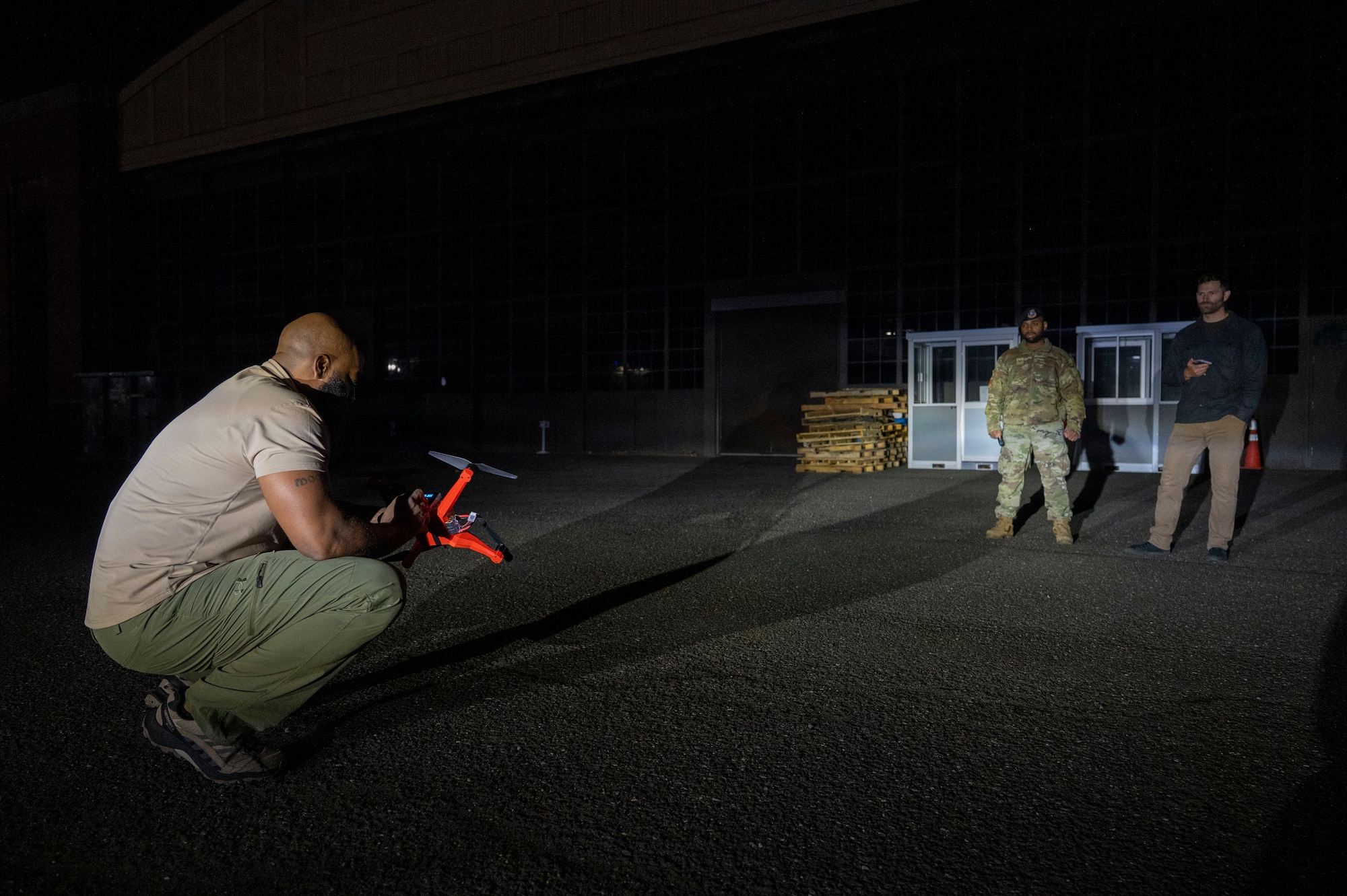 Technicians operating a drone