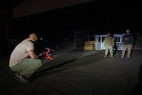 Technicians operating a drone