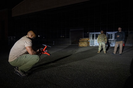 Technicians operating a drone