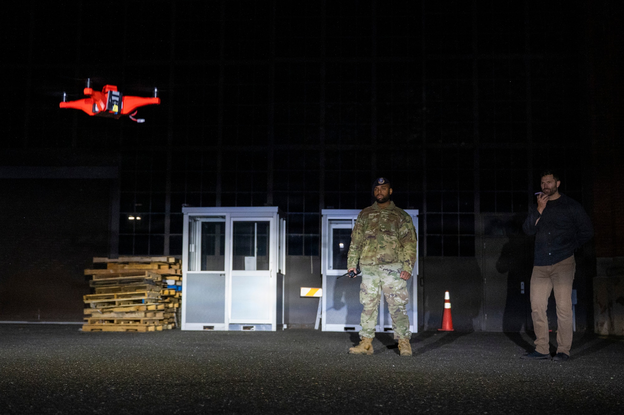 Technicians operating a drone