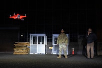 Technicians operating a drone