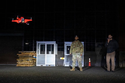Technicians operating a drone