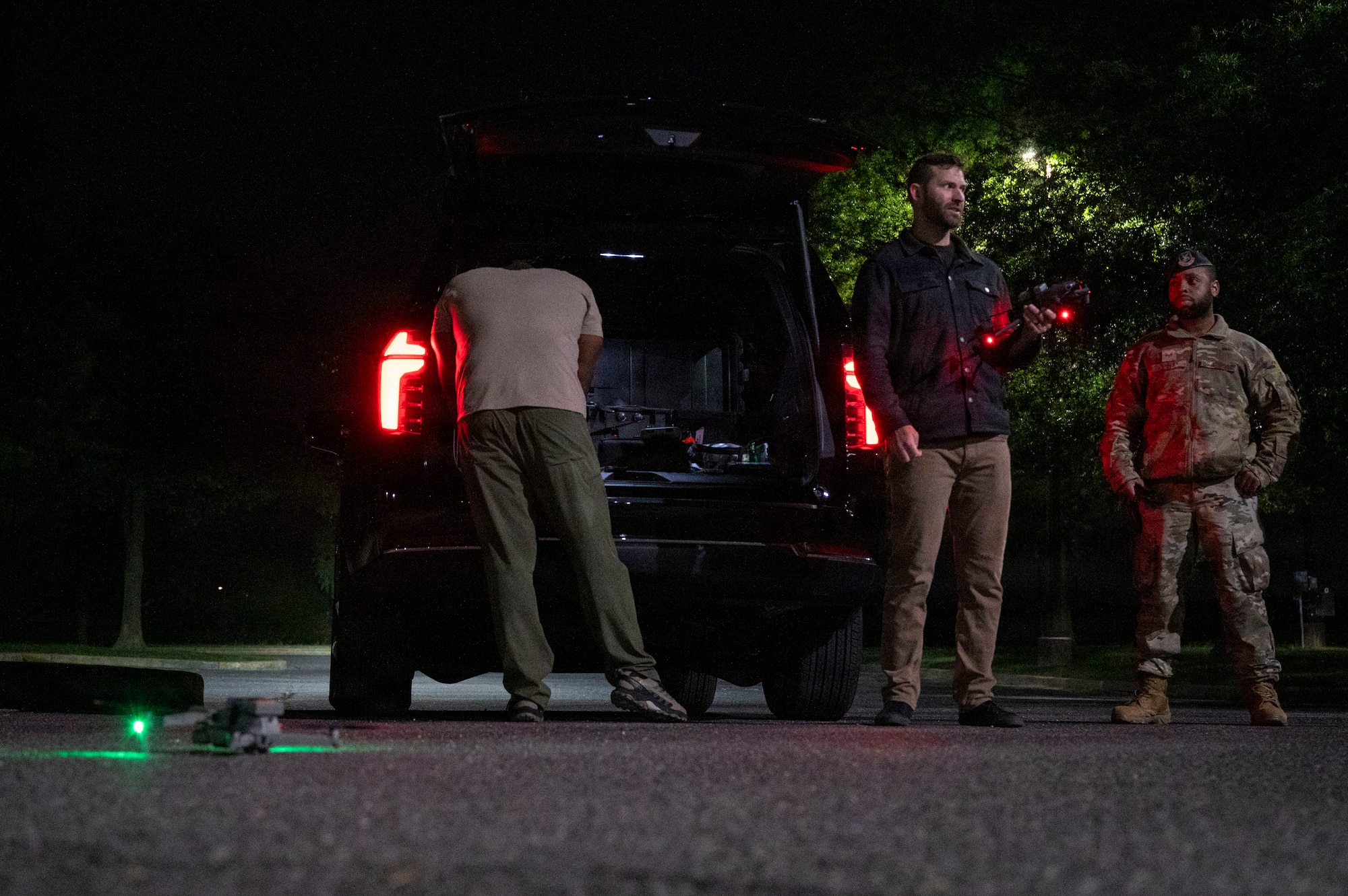 Technicians operating a drone