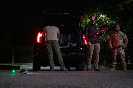 Technicians operating a drone