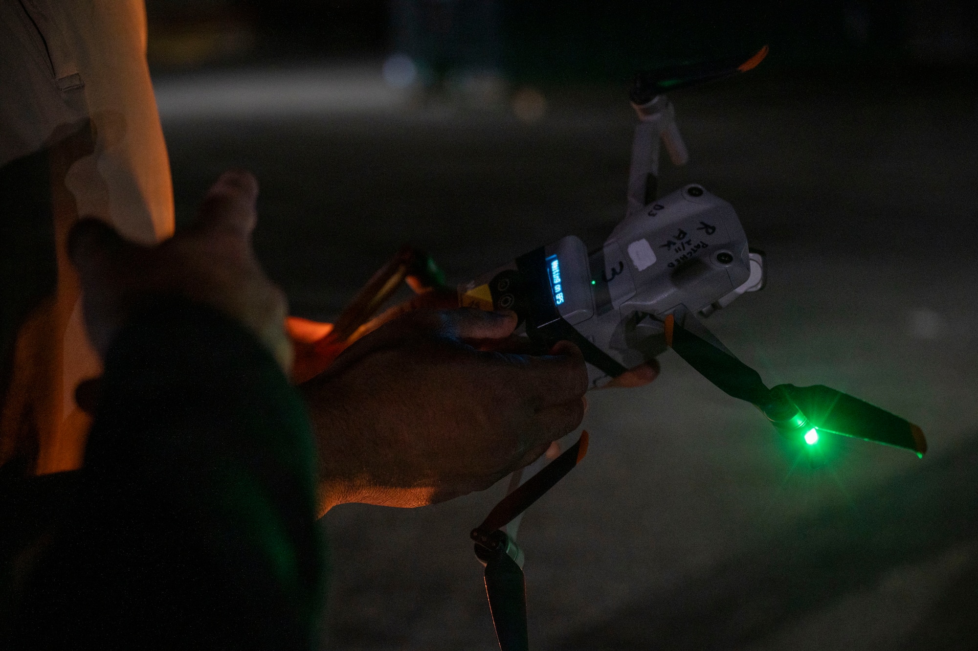 Technicians operating a drone