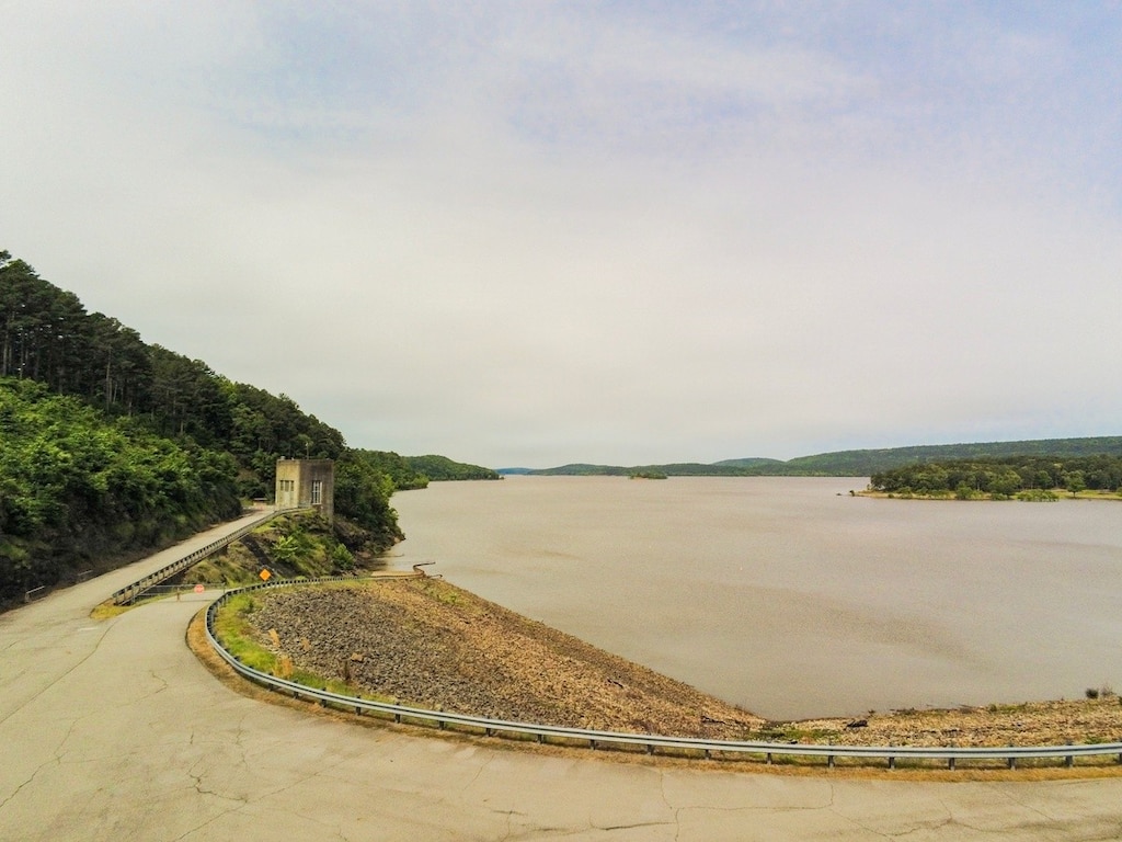 a lake with a road running along it