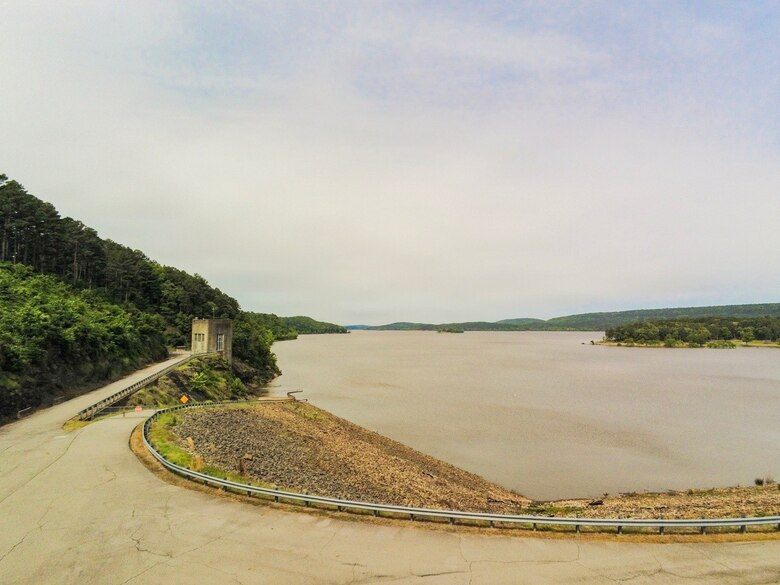 a lake with a road running along it