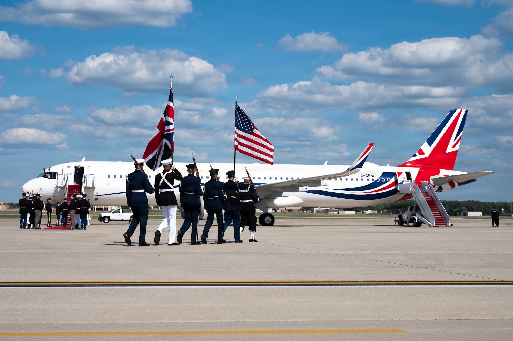 U.S. service members with an armed forces full honor cordon march to their positions next to a United Kingdom aircraft during a departure ceremony for His Majesty of the United Kingdom of Great Britain and Northern Ireland, King Charles III, at Joint Base Andrews, Maryland, April 30, 2026. The ceremony marked the conclusion of the first royal state visit to the United States following His Majesty’s ascension to the throne. (U.S. Air Force photo by Staff Sgt. Alex Broome)