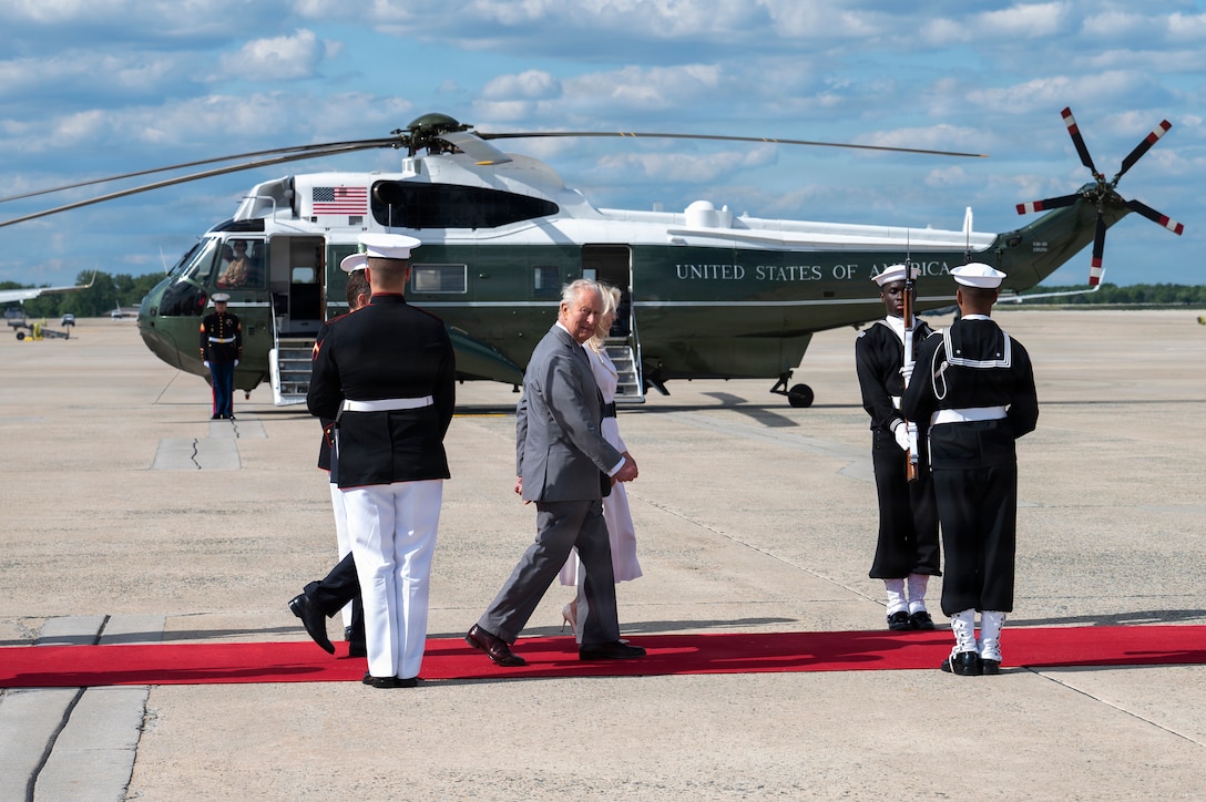 His Majesty of the United Kingdom of Great Britain and Northern Ireland, King Charles III, front, and Chief of Protocol of the United States Monica Crowley walk down a red carpet during a military departure ceremony at Joint Base Andrews, Maryland, April 30, 2026. The ceremony marked the conclusion of the first royal state visit to the U.S. since His Majesty’s ascension to the throne. (U.S. Air Force photo by Staff Sgt. Alex Broome)