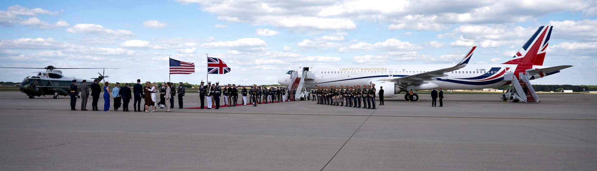 U.S. service members with an armed forces full honor cordon and Soldiers with the U.S. Army Band stand at attention next to a United Kingdom aircraft during a departure ceremony for His Majesty of the United Kingdom of Great Britain and Northern Ireland, King Charles III at Joint Base Andrews, Maryland, April 30, 2026. The ceremony marked the conclusion of the first royal state visit to the United States following His Majesty’s ascension to the throne. (U.S. Air Force photo by Staff Sgt. Alex Broome)