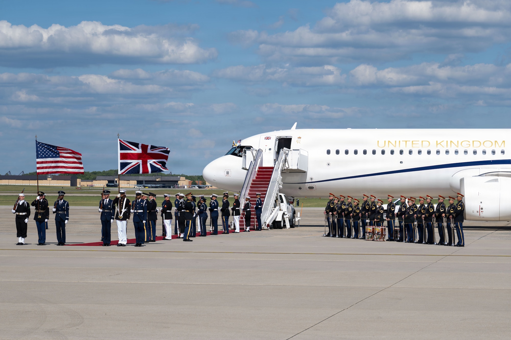 U.S. service members with an armed forces full honor cordon stand at attention next to a United Kingdom aircraft during a departure ceremony for His Majesty of the United Kingdom of Great Britain and Northern Ireland, King Charles III, at Joint Base Andrews, Maryland, April 30, 2026. The ceremony marked the conclusion of the first royal state visit to the United States following His Majesty’s ascension to the throne. (U.S. Air Force photo by Airman 1st Class Mauricio Hidalgo)