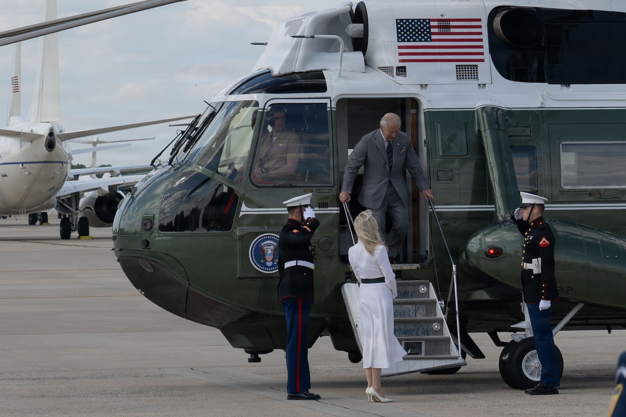 His Majesty of the United Kingdom of Great Britain and Northern Ireland, King Charles III, descends from a U.S. Marine Corps VH-3D Sea King helicopter and is greeted by Chief of Protocol of the United States Monica Crowley at Joint Base Andrews, Maryland, April 30, 2026. His Majesty arrived at the flight line for a military departure ceremony, marking the conclusion of the first royal state visit to the United States since his ascension to the throne. (U.S. Air Force photo by Airman 1st Class Mauricio Hidalgo)