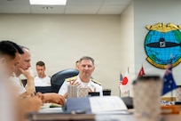 JOINT BASE PEARL HARBOR-HICKAM (April 8, 2026) — Rear Adm. Chris Cavanaugh, center, commander, Submarine Force, U.S. Pacific Fleet, provides opening remarks to various leaders during the 2026 Undersea Warfare Commanders’ Conference (USWCC) at Joint Base Pearl Harbor-Hickam, Hawaii, April 8, 2026. First held in 2018, this year’s conference theme was “Shaping the future: Moving forward quickly and collaboratively to assure our combined advantage in the undersea domain.” The USWCC conference included submarine force representatives from Australia, Canada, France, Japan, Republic of Korea, and Singapore. The multi-day event included briefings from each partner nation focused on force employment, combat readiness, interoperability, and integration of emerging technology such as unmanned systems and artificial intelligence. (U.S. Navy photo by Chief Mass Communication Specialist Omar A. Dominquez)