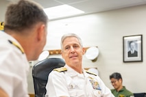 JOINT BASE PEARL HARBOR-HICKAM (April 8, 2026) — Adm. Steve Koehler, right, commander, U.S. Pacific Fleet, speaks with Rear Adm. Chris Cavanaugh, left, commander, Submarine Force, U.S. Pacific Fleet, during the 2026 Undersea Warfare Commanders’ Conference (USWCC) at Joint Base Pearl Harbor-Hickam, Hawaii, April 8, 2026. First held in 2018, this year’s conference theme was “Shaping the future: Moving forward quickly and collaboratively to assure our combined advantage in the undersea domain.” The USWCC conference included submarine force representatives from Australia, Canada, France, Japan, Republic of Korea, and Singapore. The multi-day event included briefings from each partner nation focused on force employment, combat readiness, interoperability, and integration of emerging technology such as unmanned systems and artificial intelligence. (U.S. Navy photo by Chief Mass Communication Specialist Omar A. Dominquez)
