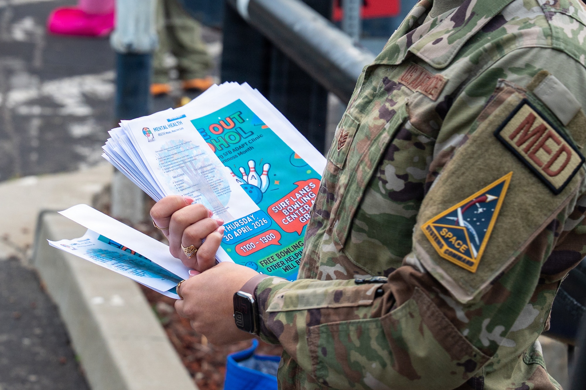 A set of hands holding onto papers