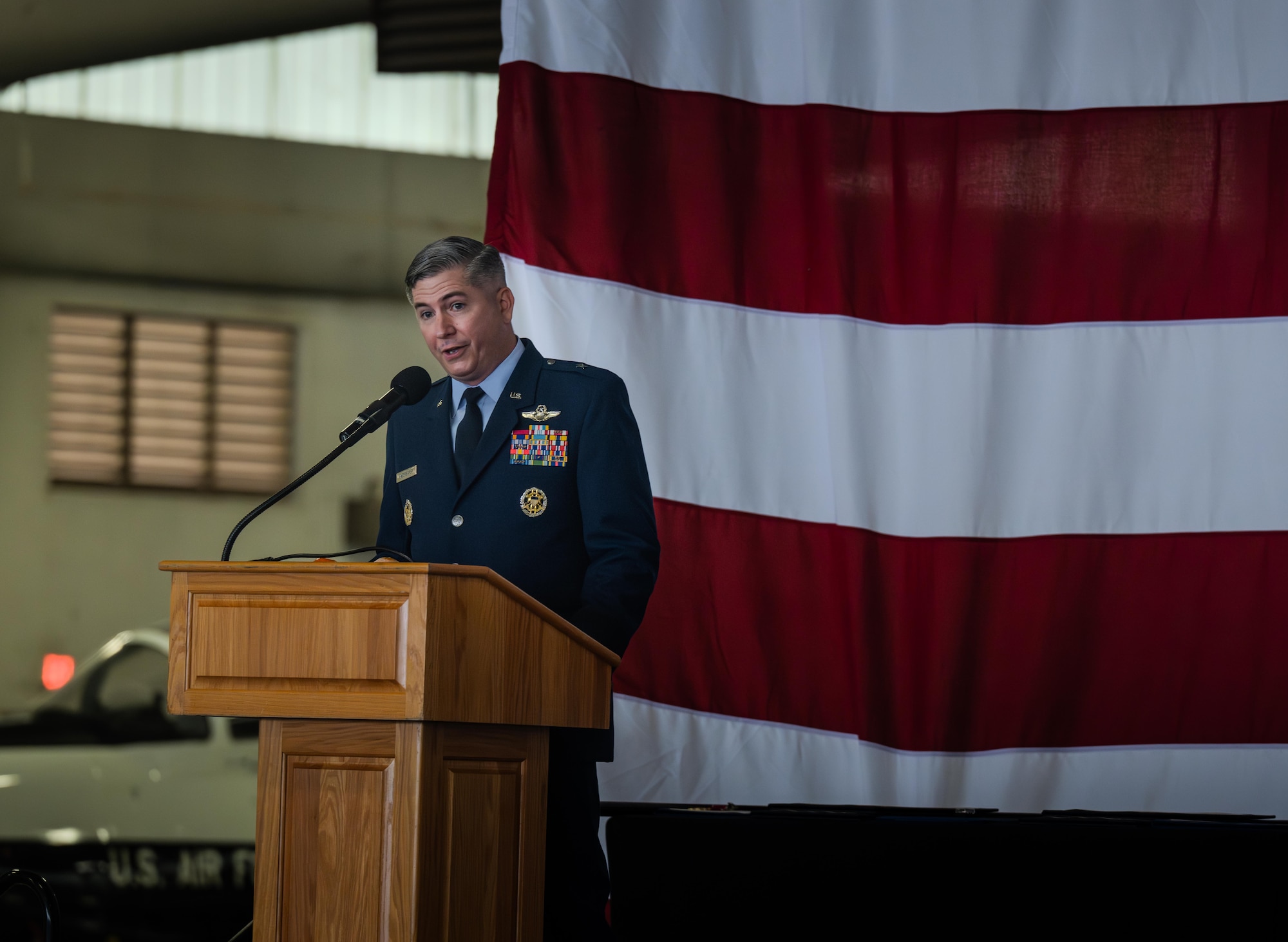 U.S. Air Force Brig. Gen. David Fazenbaker, Headquarters Air Mobility Command Director of Strategy, Plans, Requirements and Programs, speaks at the retirement ceremony of Col. Joseph McCane, 47th Operations Group, commander, at Laughlin Air Force Base, Texas, May 1, 2026. Fazenbaker highlighted the assignments that made up the 35-year career of McCane. (U.S. Air Force photo by Airman 1st Class Harrison Sullivan)