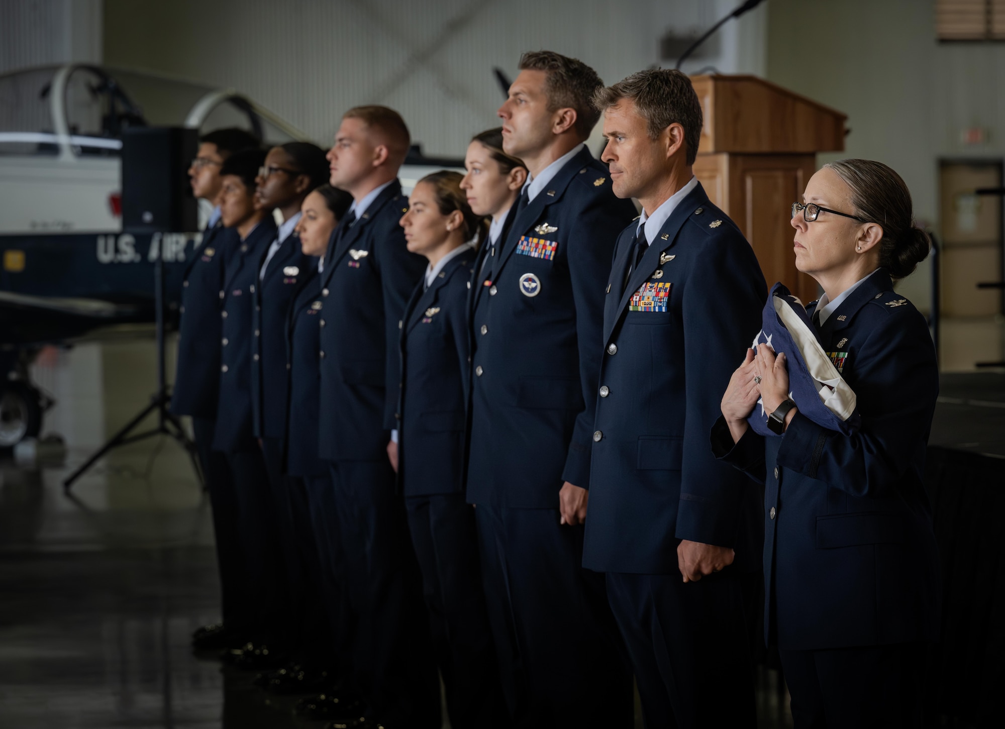 Airmen from the 47th Flying Training Wing, pass the American flag representing U.S. Air Force Col. Joseph McCane’s progression through the Air Force at Laughlin Air Force Base, Texas, May 1, 2026. The retirement ceremony celebrated the 35-year career of McCane. (U.S. Air Force photo by Airman 1st Class Harrison Sullivan)