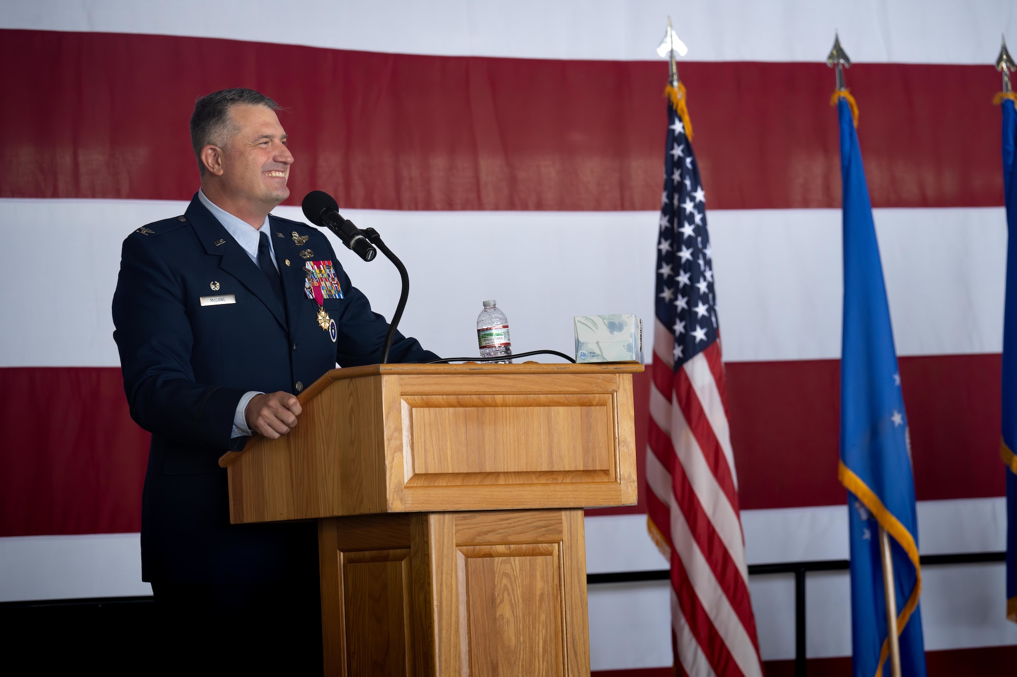 U.S Air Force Col. Joseph McCane, 47th Operations Group commander, speaks to the crowd during his retirement ceremony at Laughlin Air Force Base, Texas, May 1, 2026. The retirement ceremony celebrated the 35-year career of McCane. (U.S. Air Force photo by Airman 1st Class Harrison Sullivan)