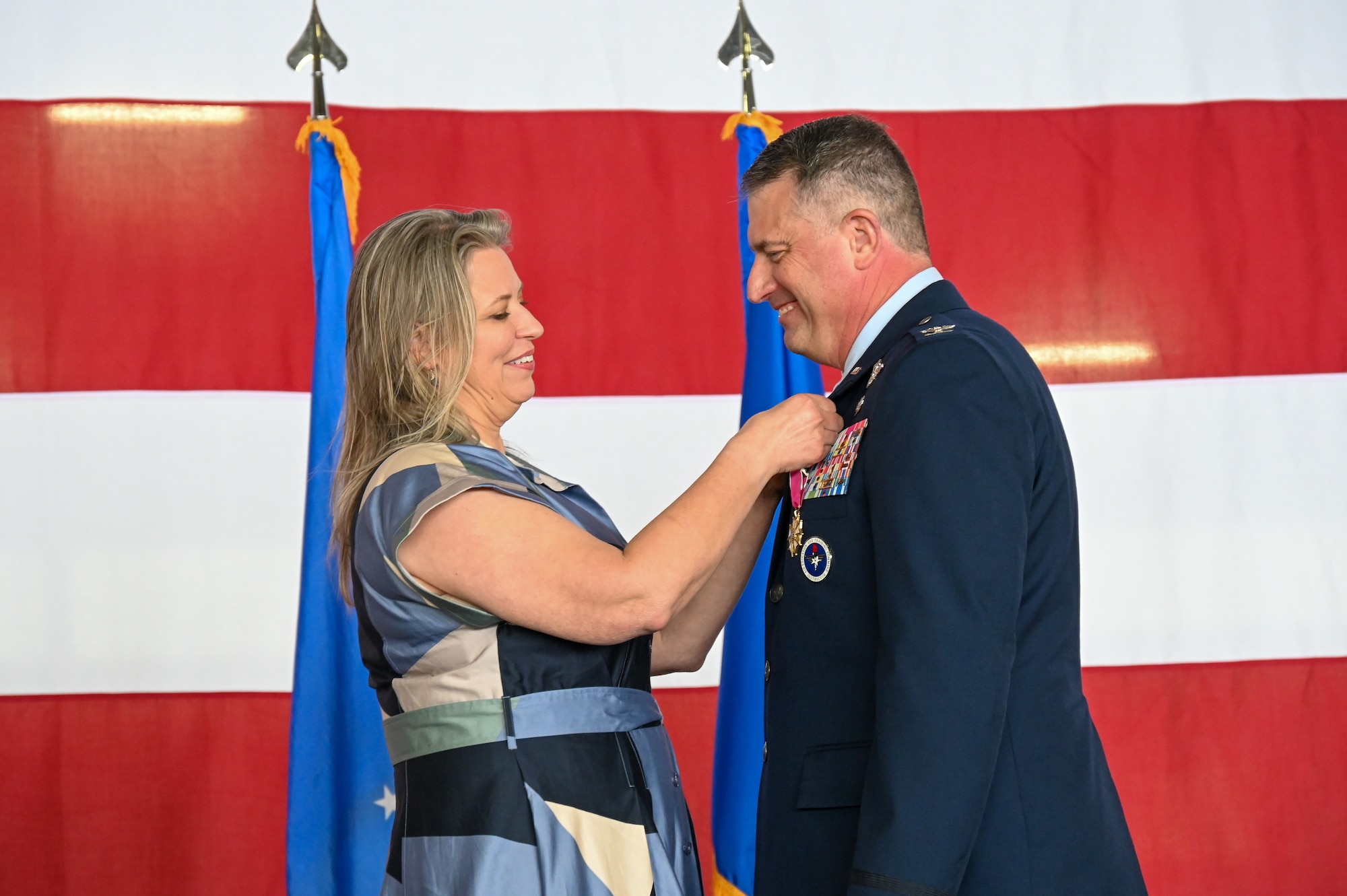 From left, Lori McCane, spouse of U.S. Air Force Col. Joseph McCane, 47th Operations Group, pins the Air Force Retired Lapel Pin on her spouse during a retirement ceremony at Laughlin Air Force Base, Texas, May 1, 2026. The retirement ceremony celebrated the 35-year career of McCane. (U.S. Air Force photo by Airman 1st Class Kylie Rabb)