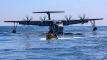U.S. Navy Sailors, assigned to Expeditionary Resuscitative Surgical System 4, return to Whidbey Island-class dock landing ship USS Ashland (LSD 48) after visiting a Japan Maritime Self-Defense Force ShinMaywa US-2 aircraft, assigned to Air Rescue Squadron 71 (ARS-71), Fleet Air Wing 31, during a casualty evacuation exercise for Exercise Balikatan 2026 in the South China Sea, April 27, 2026. Balikatan is a longstanding annual exercise between the Armed Forces of the Philippines and U.S. military that represents the strength of our alliance, improves our capable combined force, and demonstrates our commitment to regional peace and prosperity. (U.S. Navy photo by Mass Communication Specialist 1st Class John B. Hetherington)