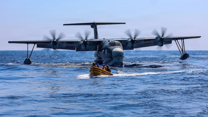 U.S. Navy Sailors, assigned to Expeditionary Resuscitative Surgical System 4, return to Whidbey Island-class dock landing ship USS Ashland (LSD 48) after visiting a Japan Maritime Self-Defense Force ShinMaywa US-2 aircraft, assigned to Air Rescue Squadron 71 (ARS-71), Fleet Air Wing 31, during a casualty evacuation exercise for Exercise Balikatan 2026 in the South China Sea, April 27, 2026. Balikatan is a longstanding annual exercise between the Armed Forces of the Philippines and U.S. military that represents the strength of our alliance, improves our capable combined force, and demonstrates our commitment to regional peace and prosperity. (U.S. Navy photo by Mass Communication Specialist 1st Class John B. Hetherington)