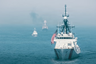 U.S. Coast Guard Legend-class cutter USC Midgett (WMSL 757), right, Philippine Coast Guard Teresa Magbanua-class patrol vessel BRP Teresa Magbanua (MRRV 9701), left, and Royal Australian Navy Anzac-class frigate HMAS Toowoomba (FFH 156) steam in formation during the group sail exercise for Exercise Balikatan 2026 in the South China Sea, April 24, 2026.
