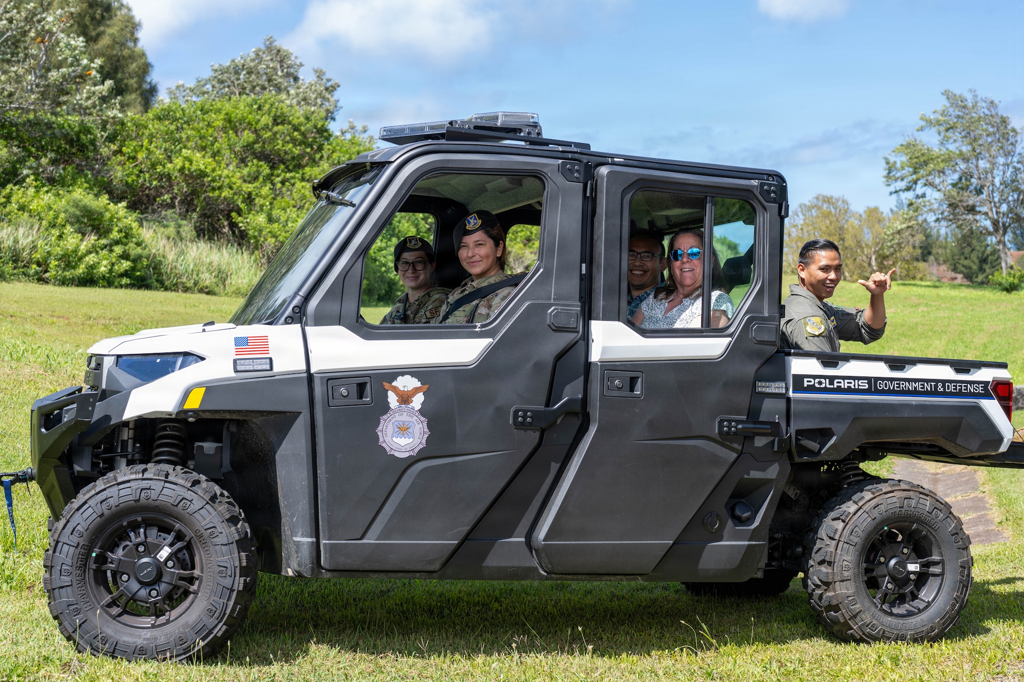 Airmen drive Team Hickam Honorary Commanders during a tour to Ka'ena Point Space Force Station.