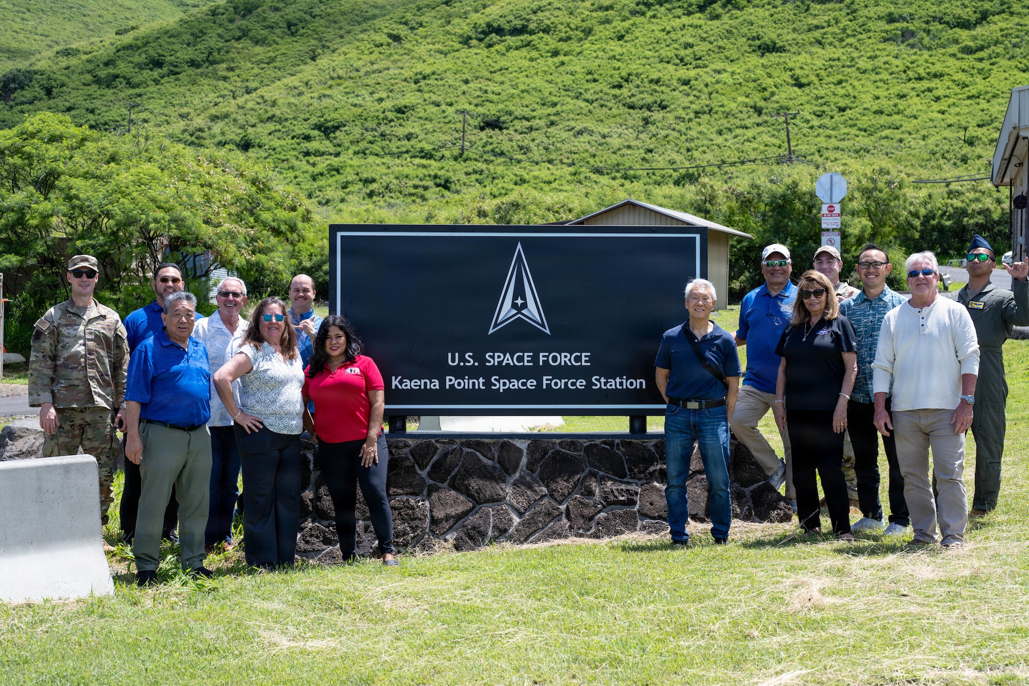 Team Hickam Honorary Commanders pose for a photo with 15th Wing leadership during a tour to Ka'ena Point Space Force Station.
